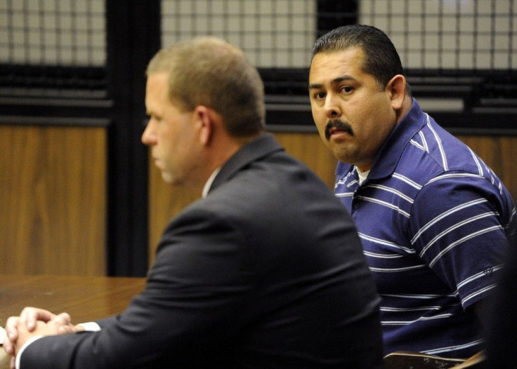 Fullerton police officers Manuel Ramos and Corporal Jay Cicinelli sit during their arraignment at a courtroom in Santa Ana, California