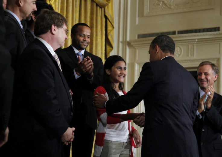 U.S. President Barack Obama greets Keiry Herrera at a No Child Left Behind event in Washington.
