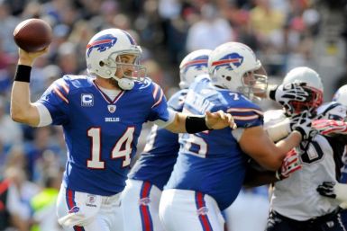 Buffalo Bills quarterback Ryan Fitzpatrick (14) is back to pass against the New England patriots, in the second quarter of their NFL football game in Orchard Park