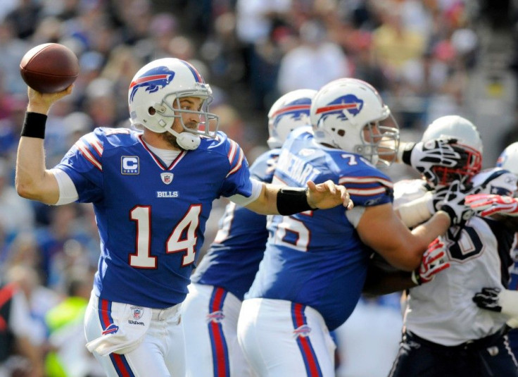 Buffalo Bills quarterback Ryan Fitzpatrick (14) is back to pass against the New England patriots, in the second quarter of their NFL football game in Orchard Park