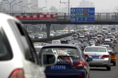 Cars can be seen in a traffic jam along a main road in central Beijing