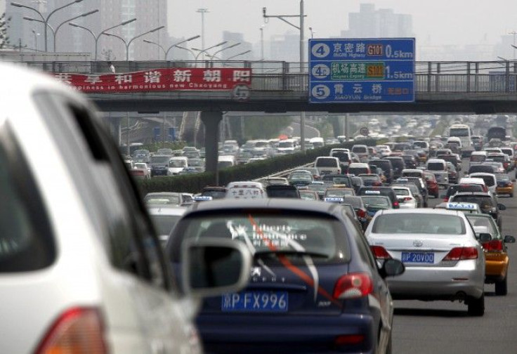 Cars can be seen in a traffic jam along a main road in central Beijing