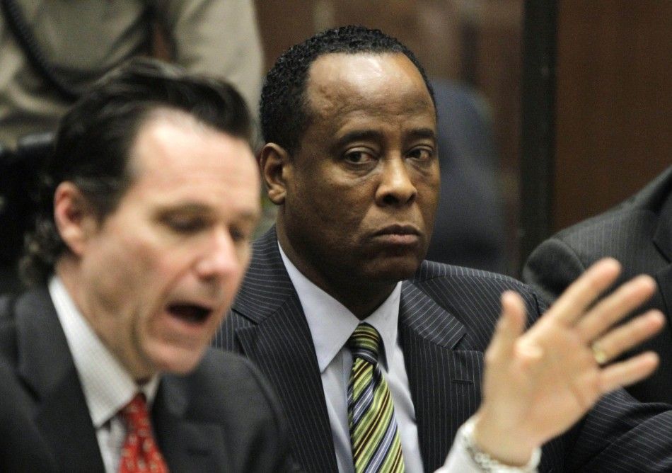 Doctor Conrad Murray sits with his lawyer Edward Chernoff during his arraignment on a charge of involuntary manslaughter in the pop stars death, in Los Angeles