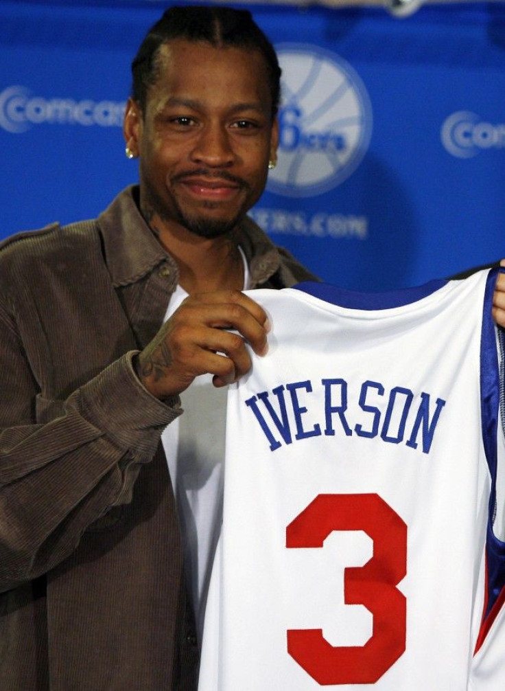 76ers guard Iverson holds up his jersey during a news conference announcing his return to the 76ers in Philadelphia Pennsylvania