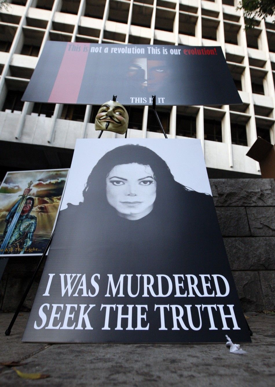 Placards are seen outside the Los Angeles Superior Court during the opening day of Dr. Conrad Murrays trial in the death of Michael Jackson