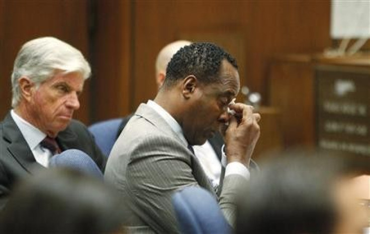 Dr. Conrad Murray (C) wipes a tear during the opening arguments in his trial in the death of pop star Michael Jackson in Los Angeles