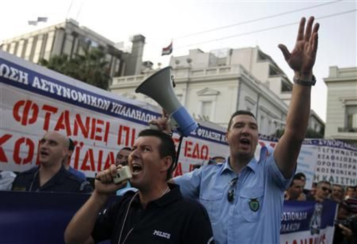 Greek police officers take part in an rally against austerity outside the parliament in Athens
