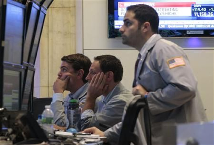 Traders work on the floor of the New York Stock Exchange