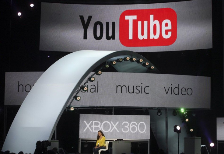 A woman demonstrates YouTube services on the Xbox game console at the Microsoft E3 XBOX 360 press briefing in Los Angeles