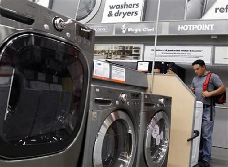 Shoppers look at washers and dryers at a Home Depot store in New York