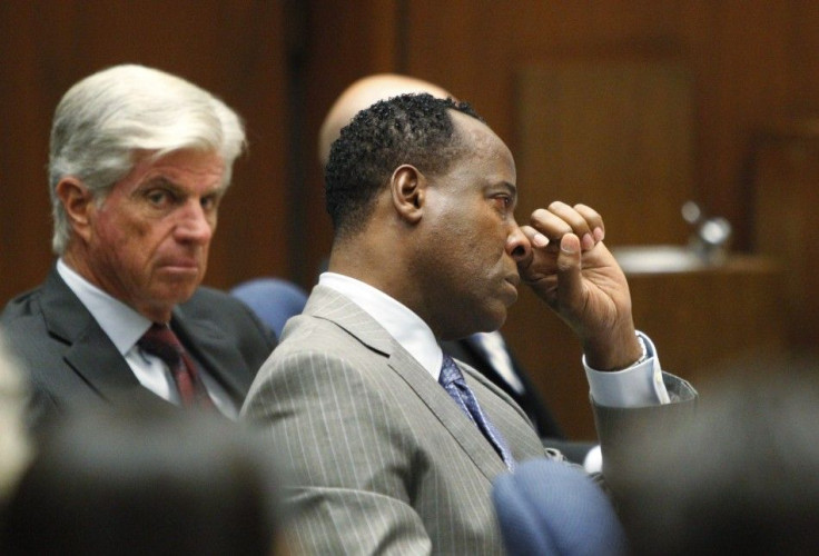 Dr. Conrad Murray wipes a tear during the opening arguments in his trial in the death of pop star Michael Jackson in Los Angeles