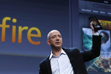 Amazon CEO Bezos holds up the new Kindle Fire tablet at news conference in New York