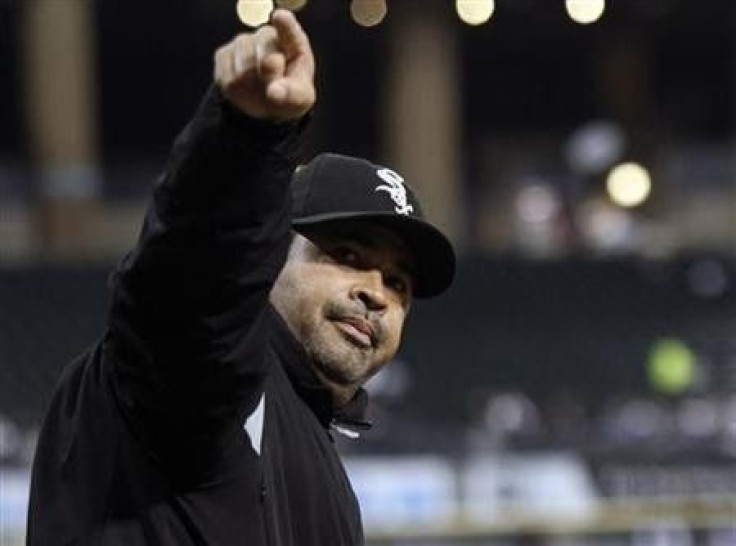 Chicago White Sox manager Ozzie Guillen points to the crowd during the first inning of their American League baseball game against the Toronto Blue Jays in Chicago, Illinois
