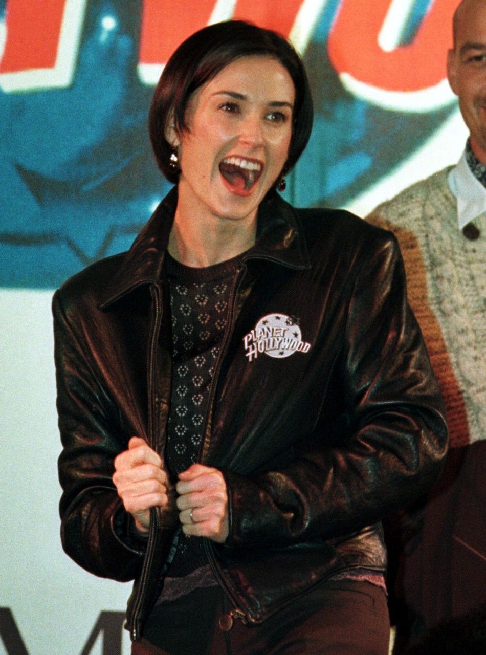 American actress Demi Moore presents a Planet Hollywood Jacket during an opening ceremony.