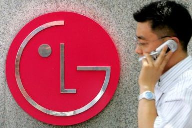 A South Korean walks past the logo of LG Electronics at its headquarters in Seoul