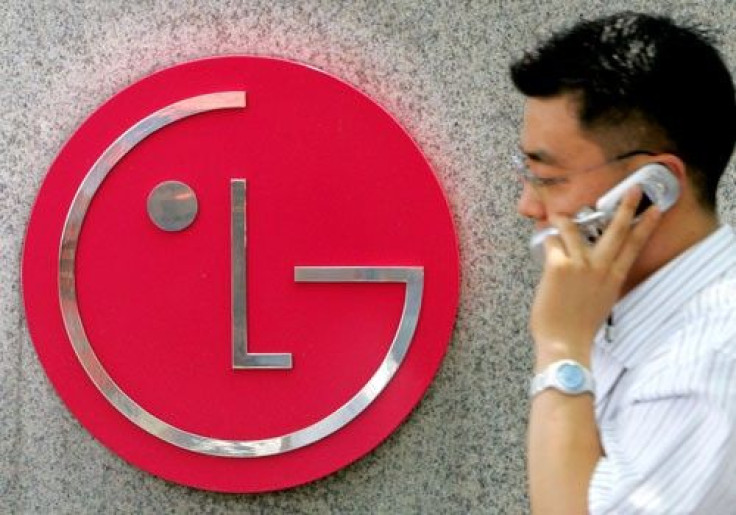 A South Korean walks past the logo of LG Electronics at its headquarters in Seoul