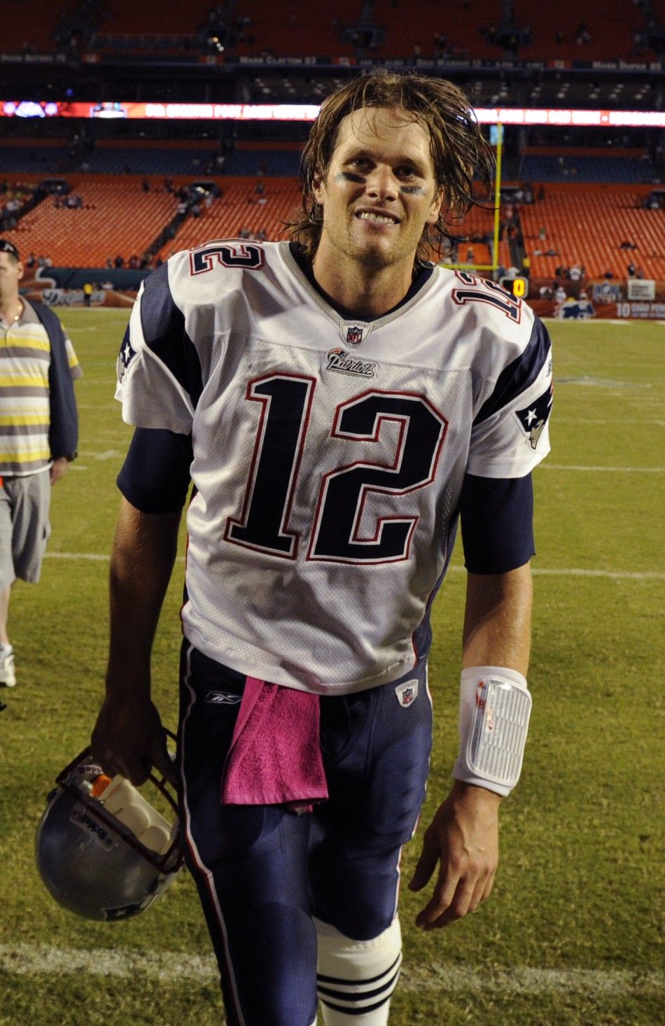 New England Patriots quarterback Tom Brady leaves the field after his teams win over the Miami Dolphins in their NFL football game in Miami, Florida October 4, 2010.