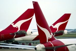 The tails bearing the logo of the 'Flying Kangaroo' of Qantas are seen at a terminal of Sydney Airport