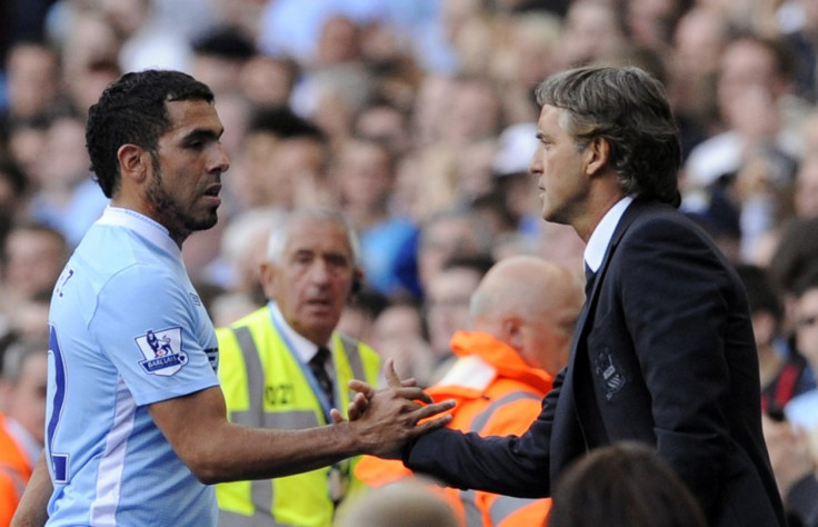 Roberto Mancini and Carlos Tevez