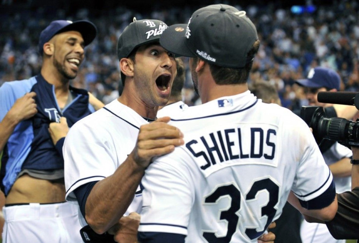 Rays&#039; Ruggiano celebrates with teammates Price and Shields after their team defeated the Yankees in their American League MLB baseball game in St. Petersburg