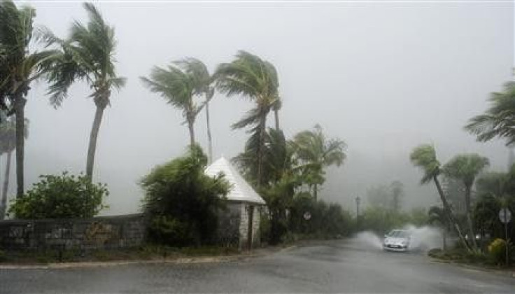 A car makes it way through driving wind and heavy rains in Southampton, Bermuda, as Hurricane Igor strikes the island,