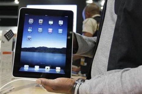 Salesman displays an Apple iPad 