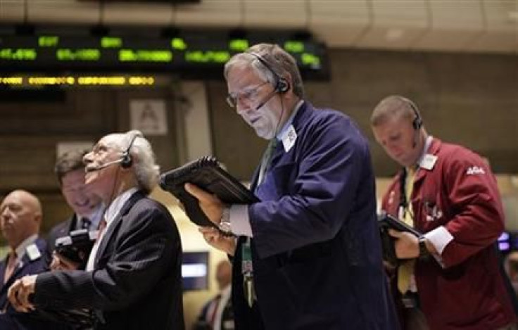 Traders work on the floor of the New York Stock Exchange