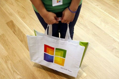 A worker holds a bag during the grand opening of Microsoft's first retail store in Scottsdale, Arizona