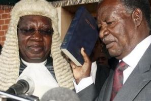 Zambian opposition leader Michael Sata (R) is sworn in as President at the supreme court in the capital Lusaka