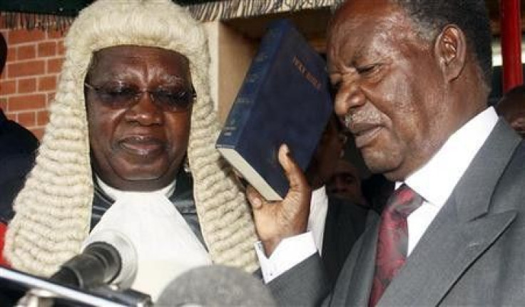 Zambian opposition leader Michael Sata (R) is sworn in as President at the supreme court in the capital Lusaka