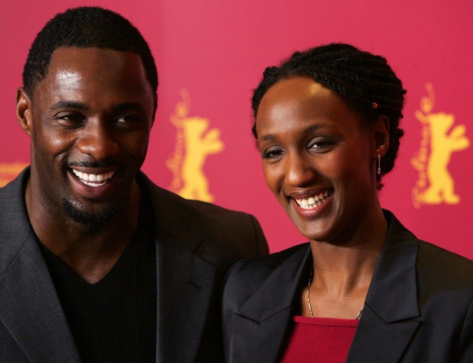 British actor Elba and actress Karemera from Rwanda pose during a photocall for the film Sometimes in April in Berlin. British actor Idris Elba and actress Carole Karemera R from Rwanda pose during a photocall for the U.S.Rwanda film Sometimes in Ap
