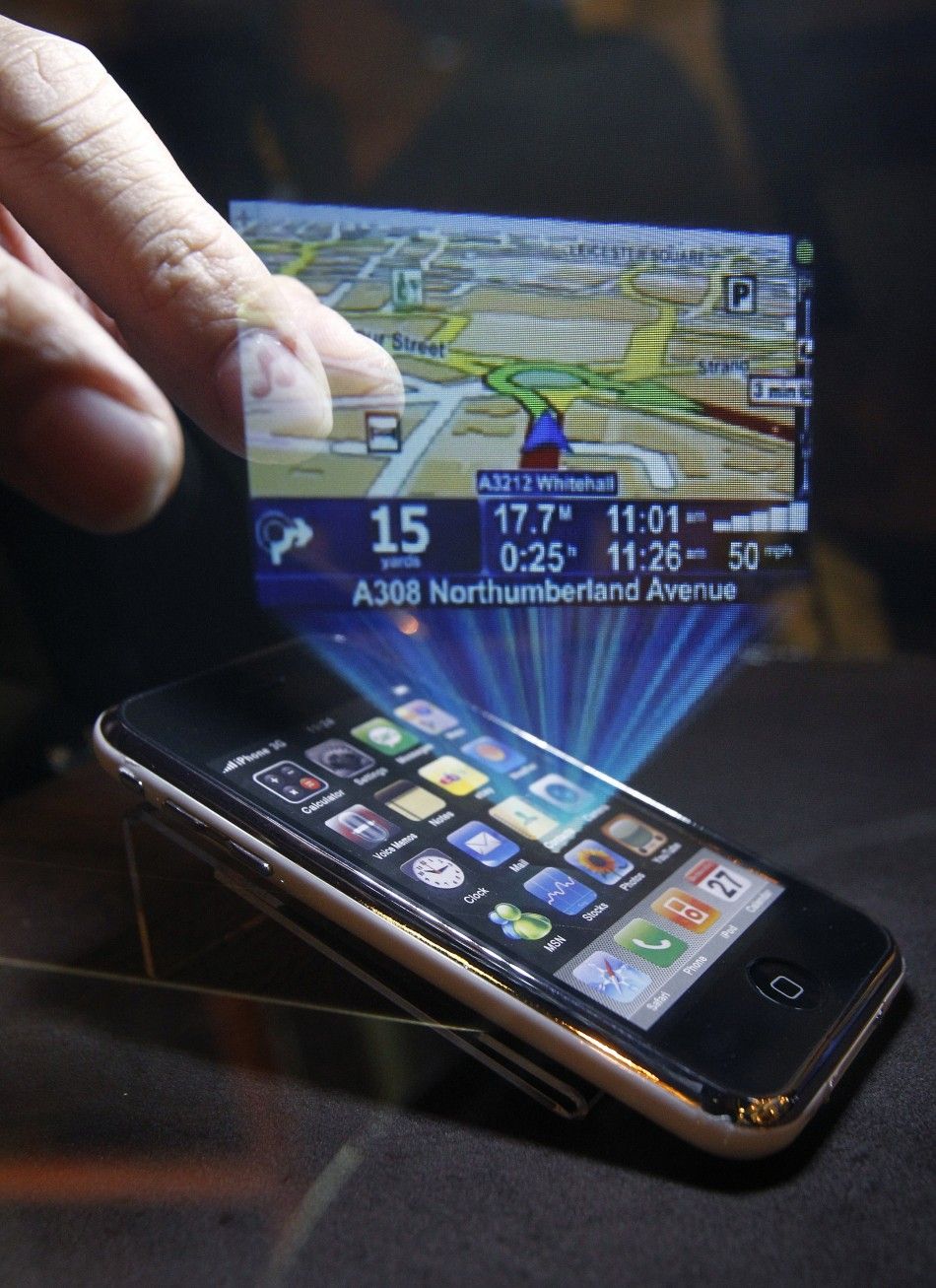  A holograph is projected above a mobile phone by a 3D projecter not pictured displayed in the Innovision booth at the Computex 2010 computer fair in Taipei