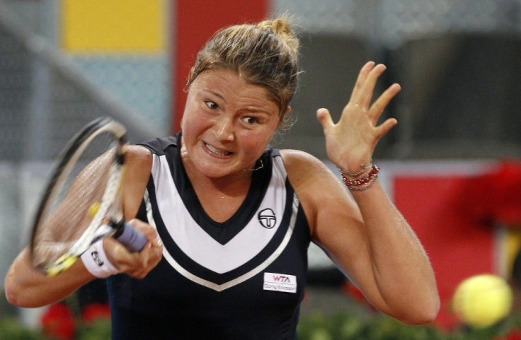 Safina of Russia returns the ball to Llagostera Vives of Spain during their Madrid Open tennis match