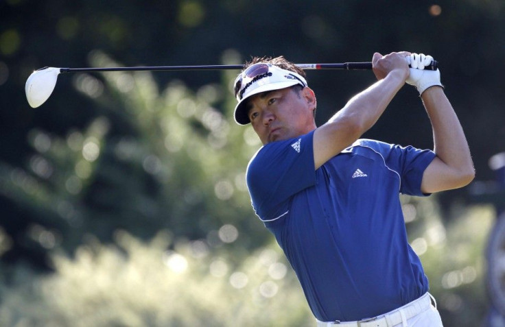 Charlie Wi of the U.S. tees off on the fifth hole during the first round of the 93rd PGA Championship golf tournament at the Atlanta Athletic Club in Johns Creek