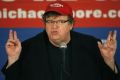 Michael Moore speaks at a news conference in Washington