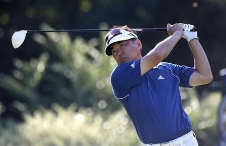 Charlie Wi of the U.S. tees off on the fifth hole during the first round of the 93rd PGA Championship golf tournament at the Atlanta Athletic Club in Johns Creek, Georgia