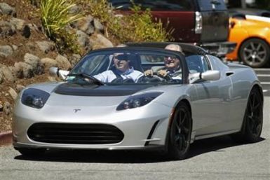 Prince Consort Henrik of Denmark tests drive a Tesla electric Roadster during his visit to the Tesla headquarters in Palo Alto