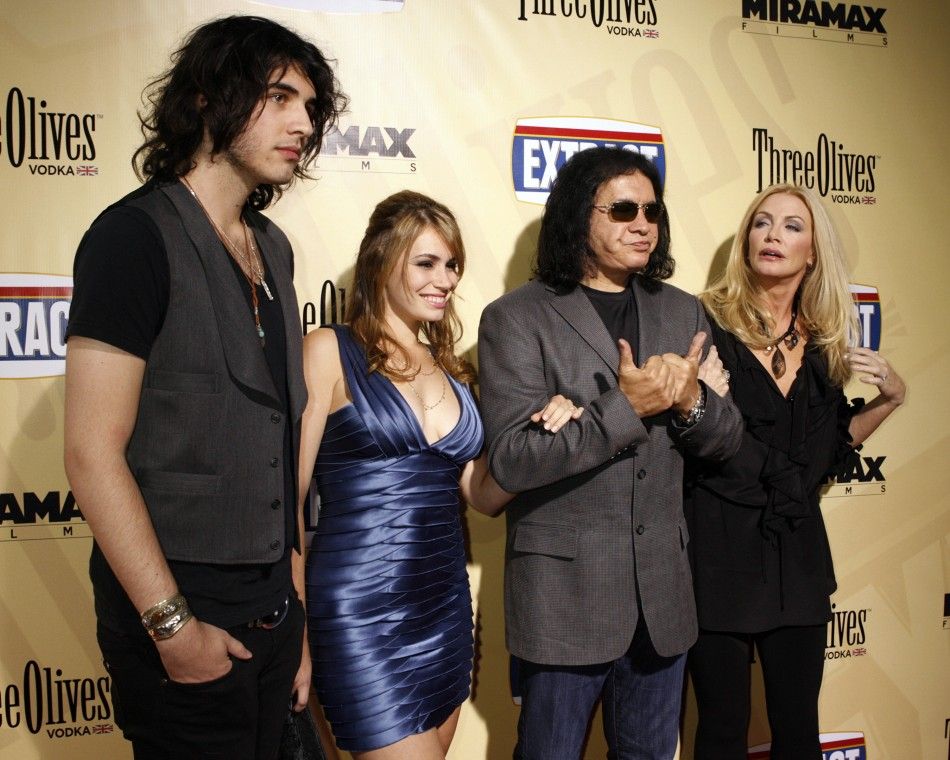 Gene Simmons, star of the film quotExtractquot, gestures as he poses at the films premiere with his partner Shannon Tweed R, their daughter Sophie Simmons 2nd L and son Nick Tweed-Simmons L in Hollywood, California