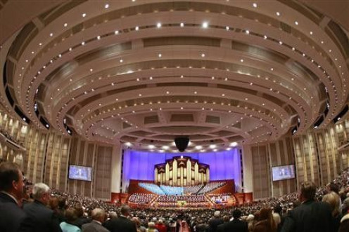 More than 20,000 Mormon faithful sing with the Mormon Tabernacle Choir at the Conference Center during the third session of their 179th annual general conference in Salt Lake City, Utah