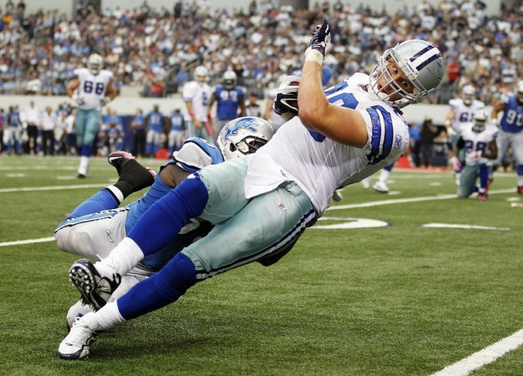 Cowboys tight end Phillips is tackled by Lions linebacker Tulloch in Arlington, Texas