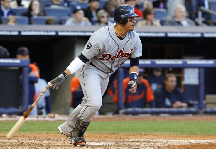 Detroit Tigers&#039; Victor Martinez hits an RBI single against the New York Yankees in Game 2 of their MLB American League Division Series baseball playoffs in New York