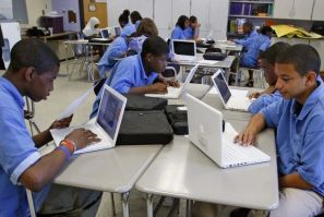 Students at the Lilla G. Frederick Pilot Middle School work on their laptops during a class in Dorchester, Massachusetts