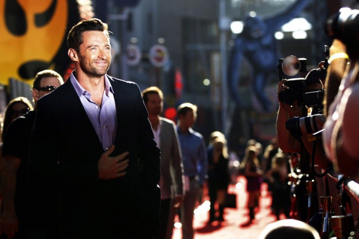 Cast member Hugh Jackman poses for photographers at the movie premiere of &quot;Real Steel&quot; in Los Angeles