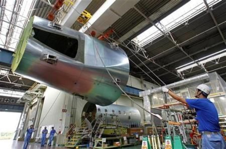 Employees move a tail structure of a Boeing 777 at Mitsubishi Heavy Industries&#039; Tobishima plant of its Nagoya Aerospace Systems Works in Nagoya