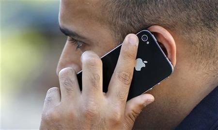 A man uses an Apple iPhone in Santa Monica, California August 24, 2011.
