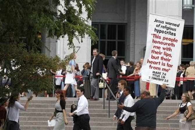 Christian street preachers protest as as faithful Mormons make their way to the conference center for the fifth session of the 181st Semiannual General Conference of the Church of Jesus Christ of Latter-day Saints in Salt Lake City, Utah