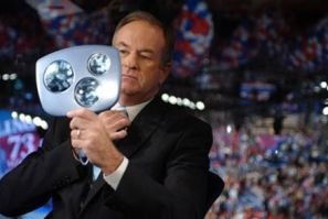 Television commentator Bill O&#039;Reilly checks himself in a mirror prior to interviewing Bono, lead singer of the Irish rock group U2, during the third night of the 2004 Republican National Convention, at Madison Square Garden in New York