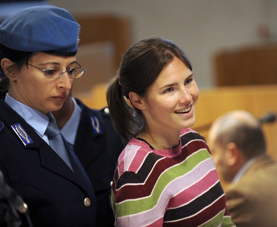Jailed suspect Amanda Knox R, 21, arrives for her murder trial session at a court in Perugia