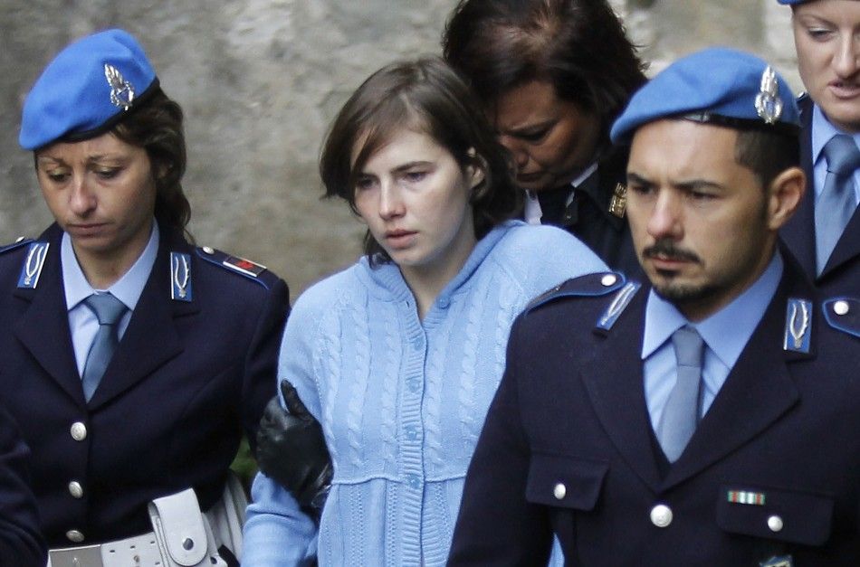 Amanda Knox, the U.S. student convicted of killing her British flatmate in Italy three years ago, leaves the court following a trial session in Perugia 
