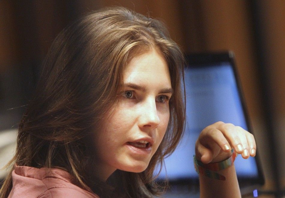 Amanda Knox, the U.S. student convicted of murdering her British flatmate Meredith Kercher in Italy on November 2007, reacts during her appeal trial session in Perugia 